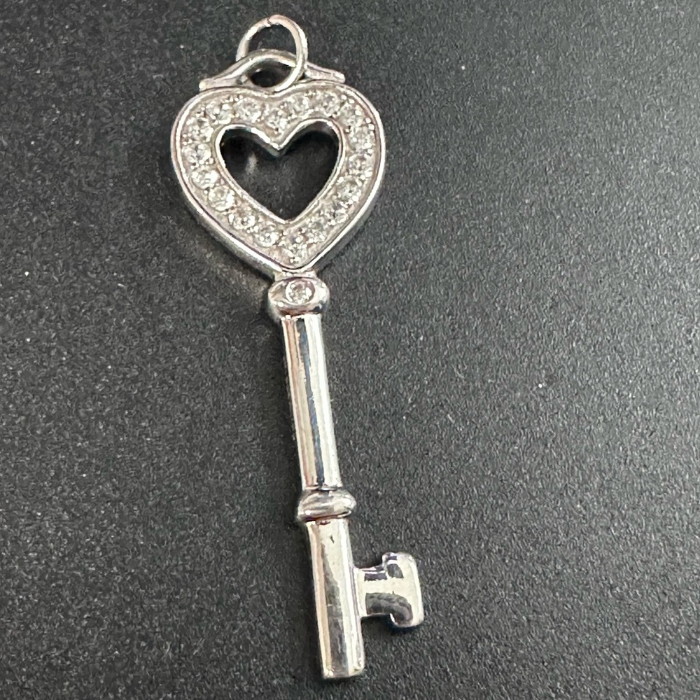17A- 925 Sterling Silver Heart Key Pendant with clear stones. Not tested.